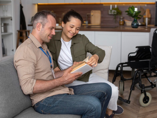 NDIS Support Coordinator Melbourne helping a man reading book